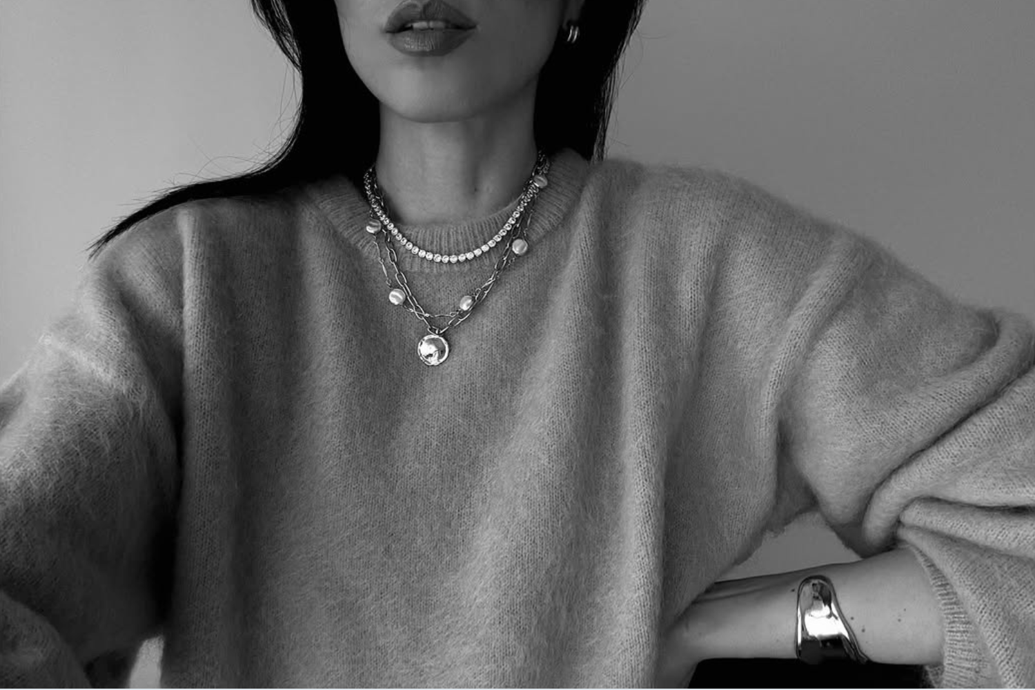 @evveroni wearing an Orelia neck stack featuring a tennis necklace